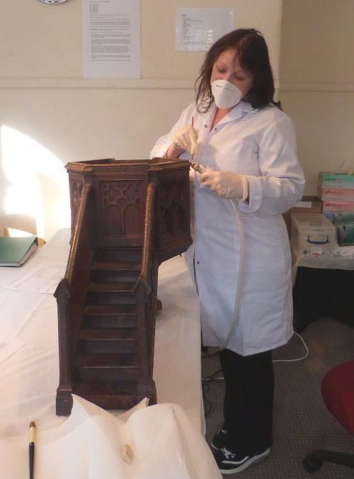 Gill cleaning a model pulpit