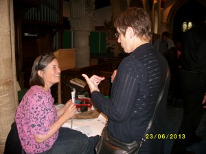 Jo Ward (seated), our Audience Development consultant, giving out her questionnaires at Ickleford Open Village