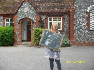 Cas outside Ickleford School with the copy of the Ratcliffe painting we have given them (it's a photo on canvas, and came out really well)